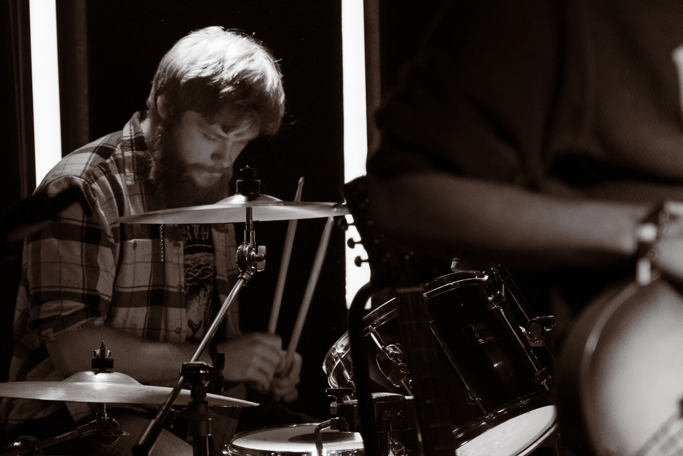 Hollowstem drummer behind the drum kit